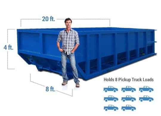 Man standing in front of a 20 yard residential dumpster rental approximately 8 pickup truck loads in size