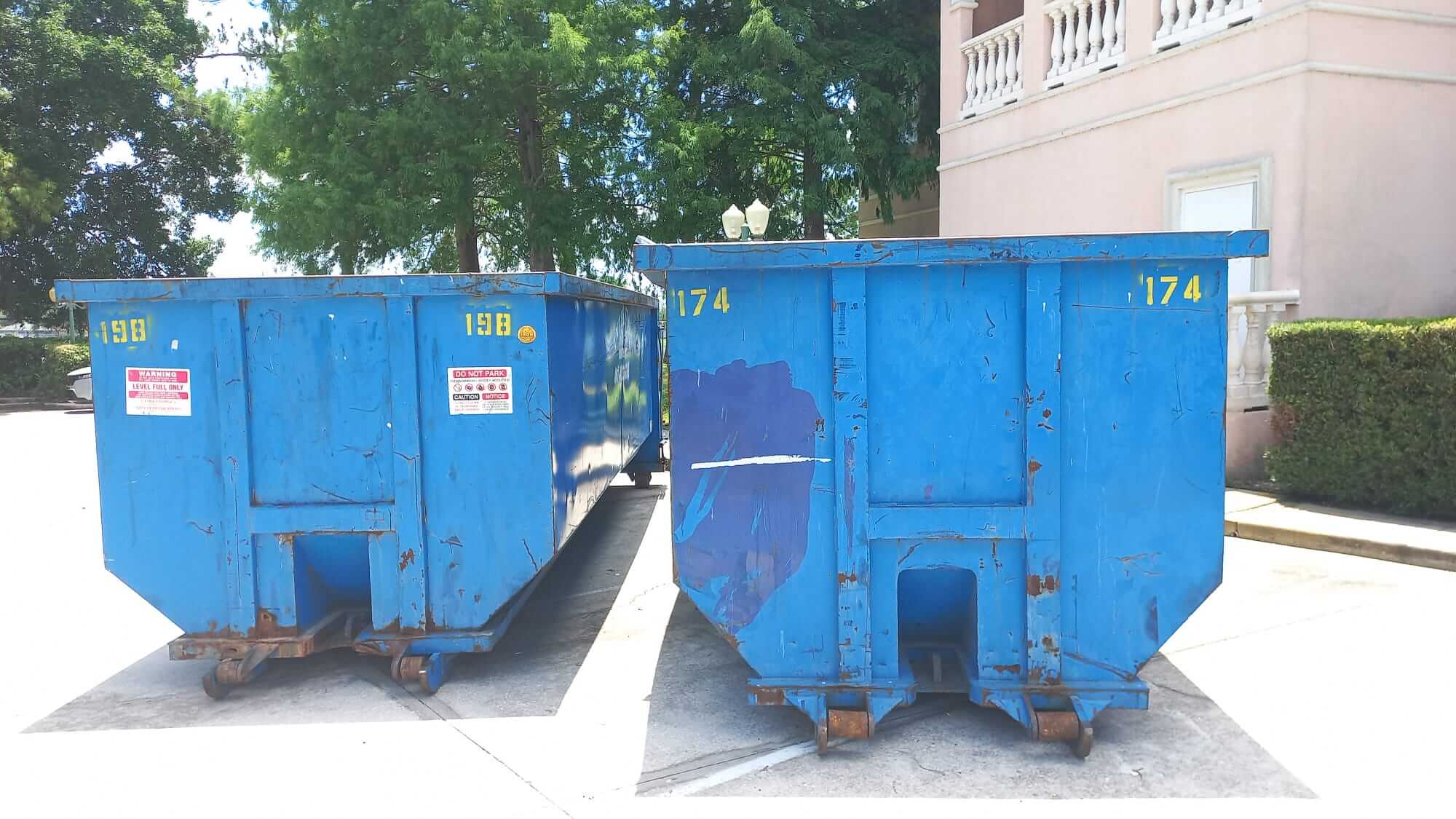 Photo of two blue dumpster rentals in Austin, TX