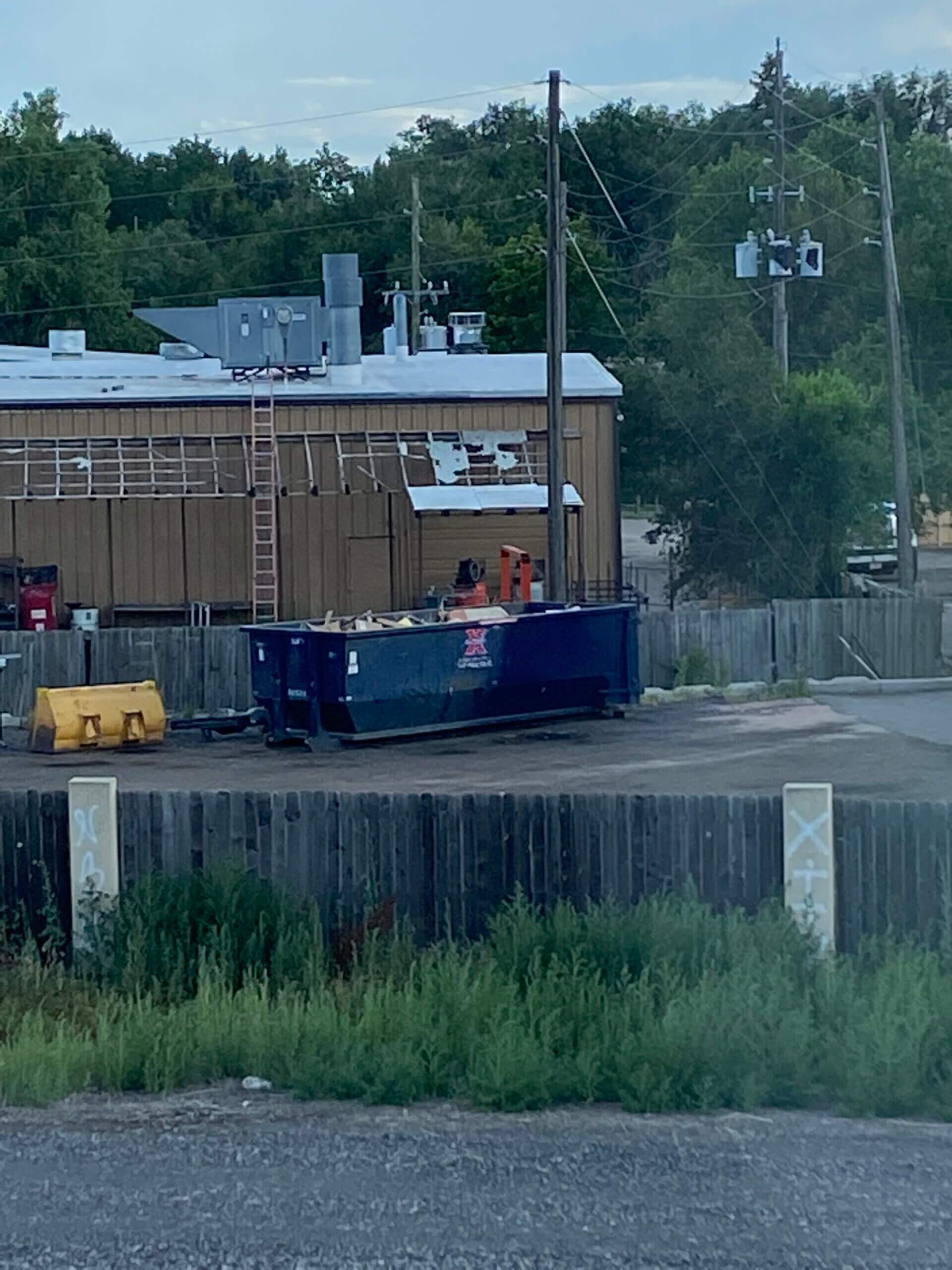 Photo of a blue dumpster rental in Birmingham, AL