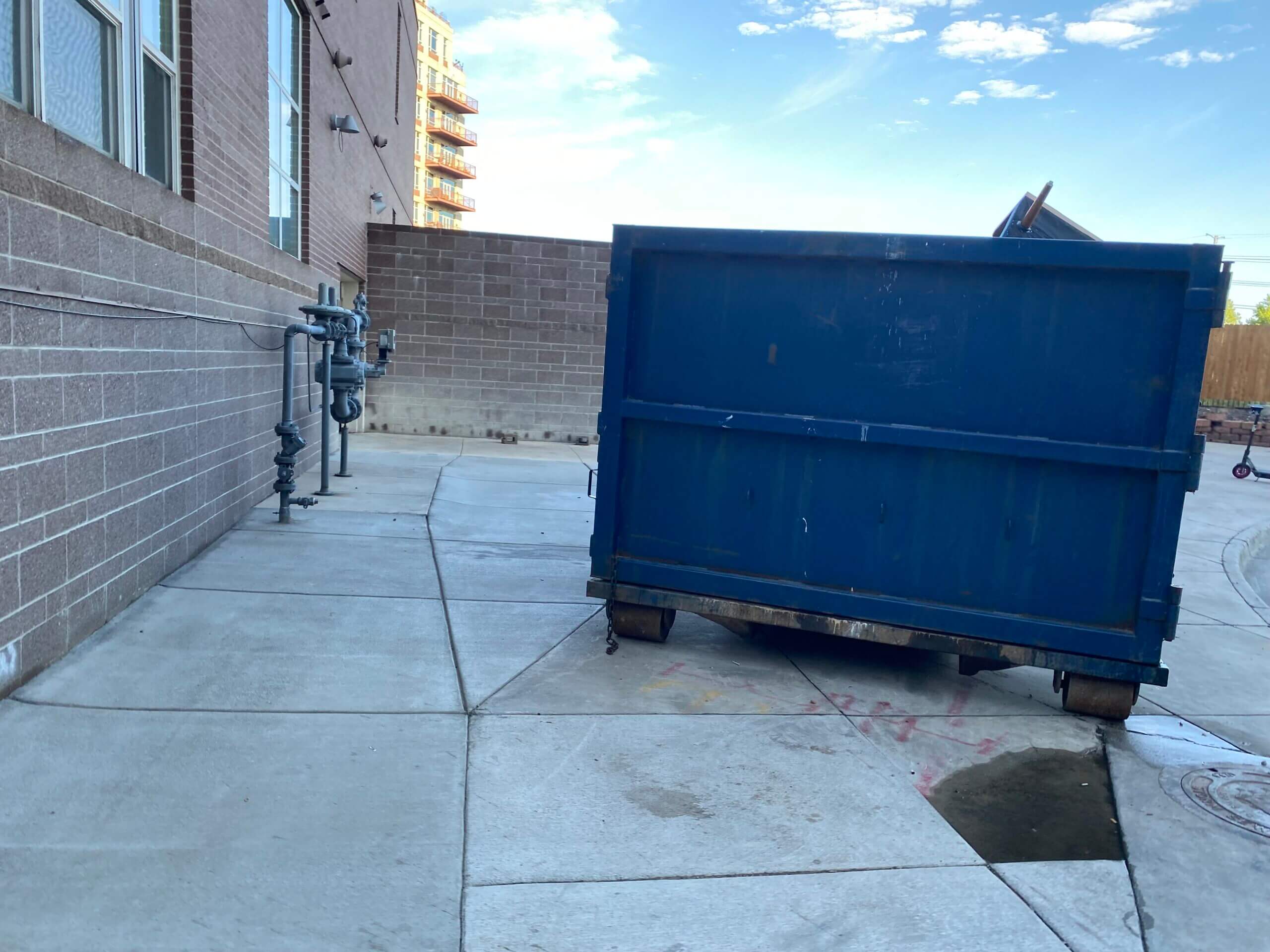 Photo of a blue dumpster rental in Charlotte, NC
