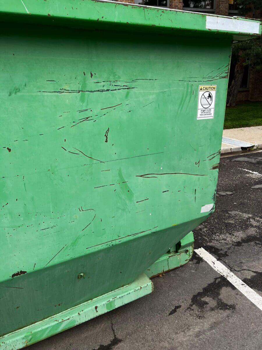 Photo of a green dumpster rental in Baltimore, MD