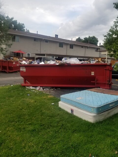 Photo of an overloaded dumpster rental in South Bend, IN