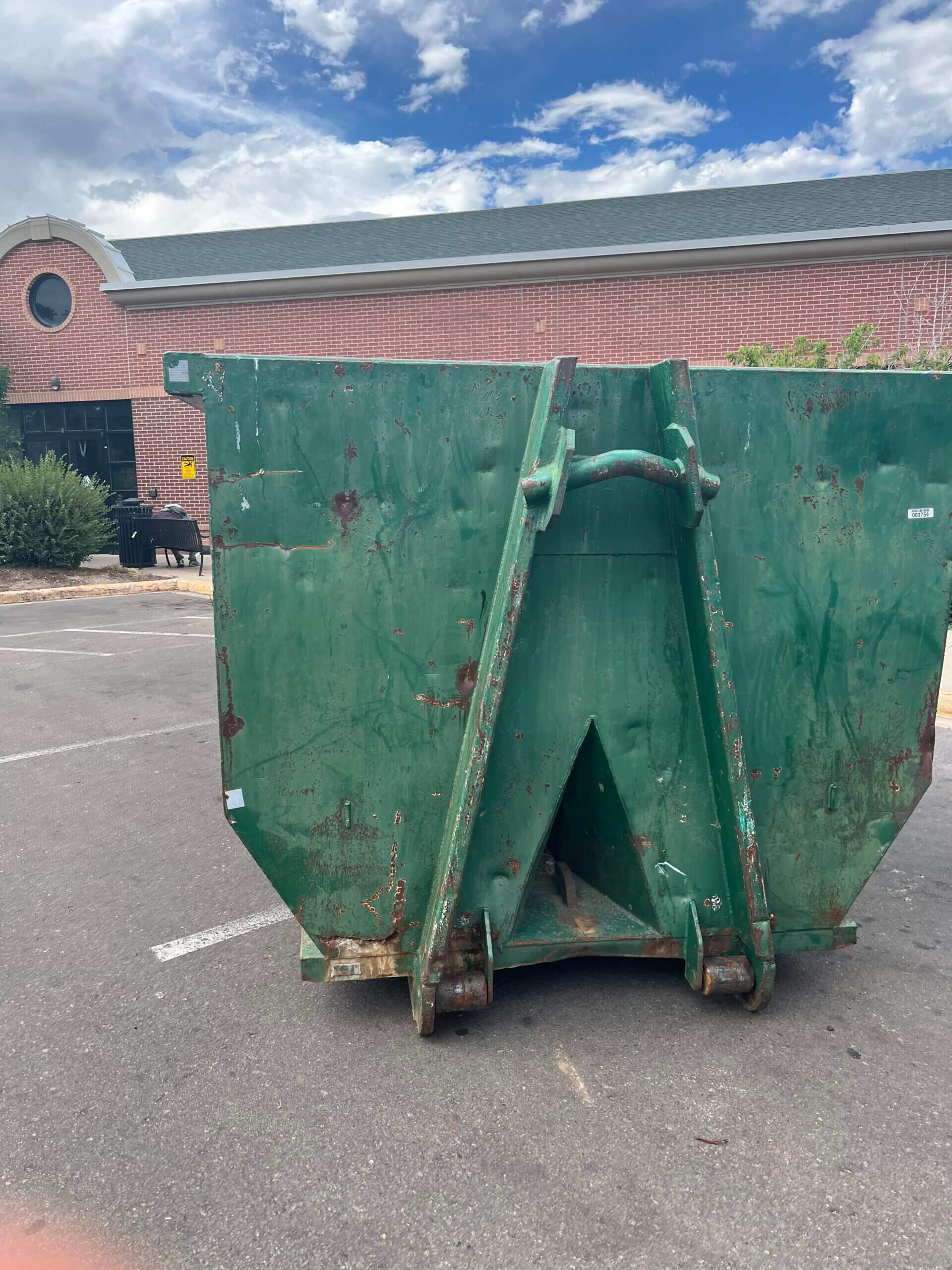 Photo of a green dumpster rental in Henderson, NV