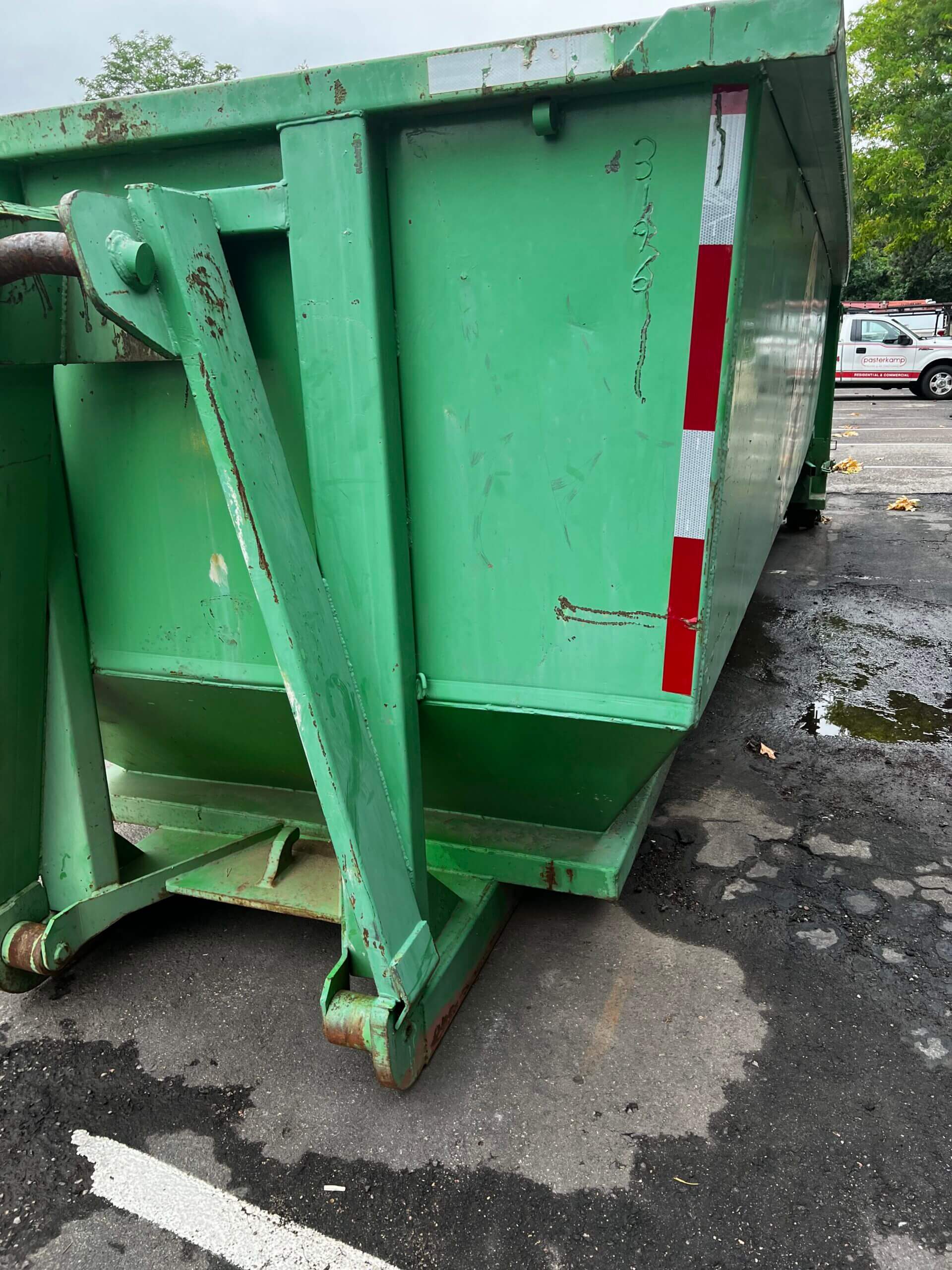 Photo of a green dumpster rental in Norfolk, VA
