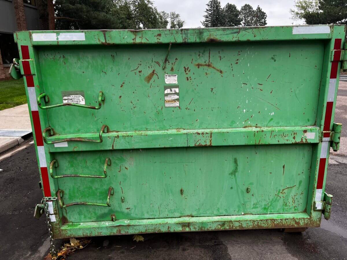 Photo of a green dumpster rental in Omaha, NE
