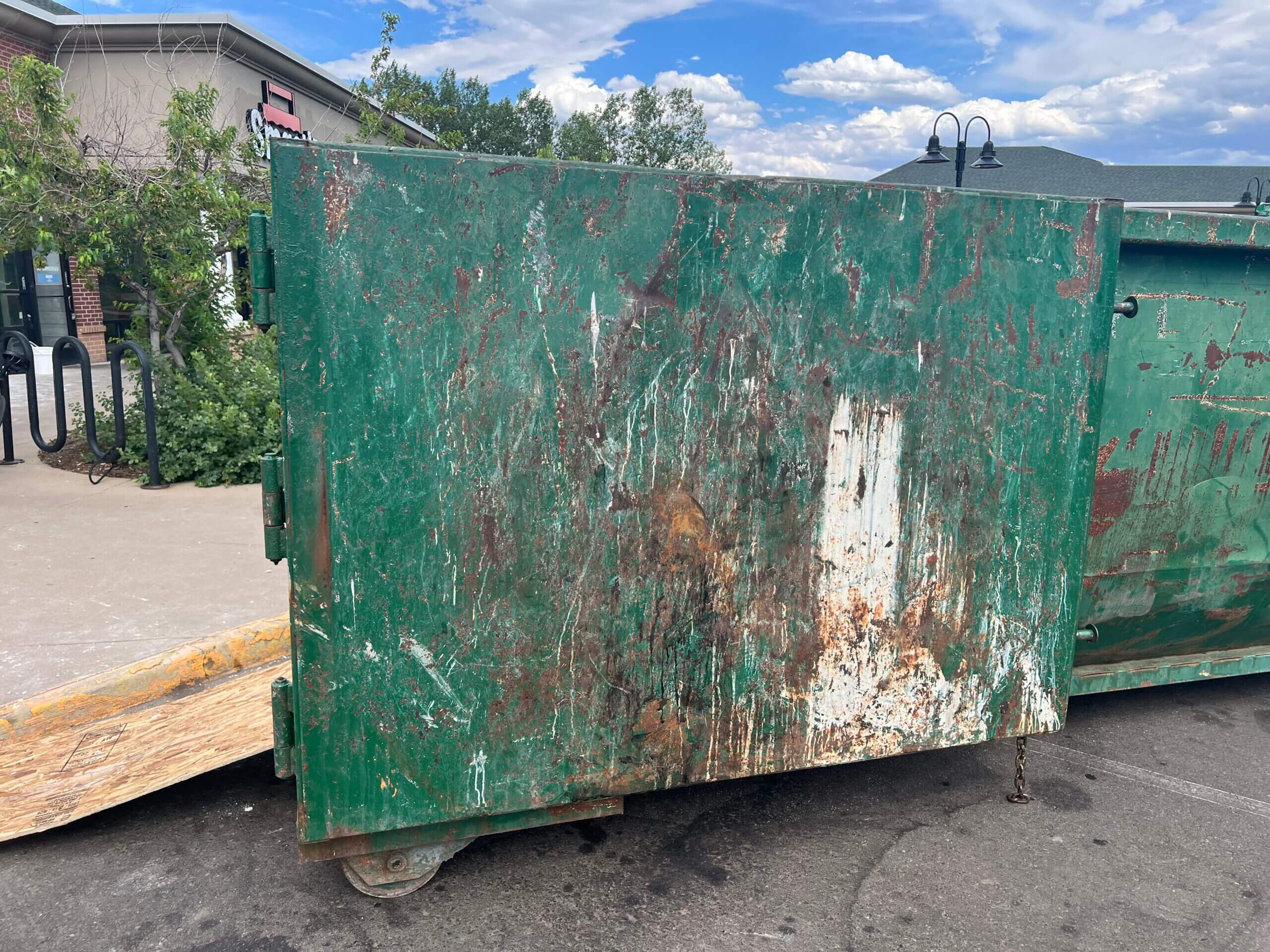 Photo of a green dumpster rental in Tampa, FL